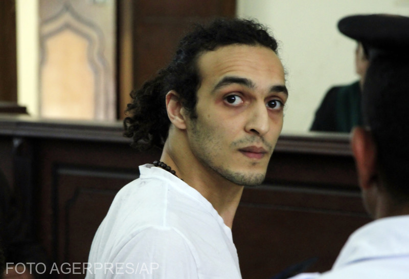 FILE - In this Thursday, May 14, 2015 file photo, Egyptian photojournalist Mahmoud Abou Zeid, known by his nickname Shawkan, appears before a judge for the first time after spending more than 600 days in prison in Cairo, Egypt. The United Nations’ cultural agency has ignored warnings from Egypt and awarded the World Press Freedom prize to an imprisoned Egyptian photographer. A jury panel for UNESCO on Monday, April 23, 2018 gave the honor to Mahmoud Abu Zeid, known as Shawkan. He has been jailed since his August 2013 arrest in Cairo while covering a demonstration at Rabaa Al-Adawiya Square. (Lobna Tarek/El Shorouk Newspaper via AP, File )